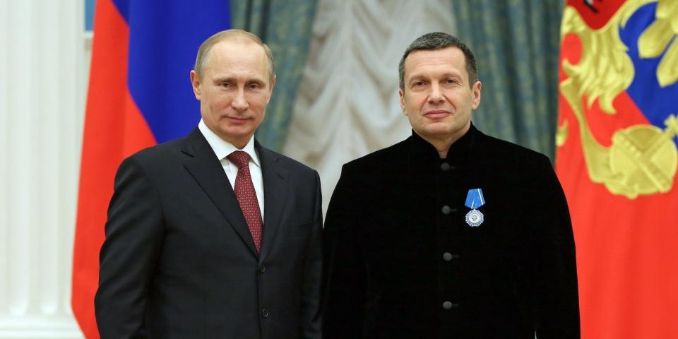 Russian President Vladimir Putin and television and radio host Vladimir Solovyov&nbsp;at an awards ceremony in Moscow, Russia, in December 2013.