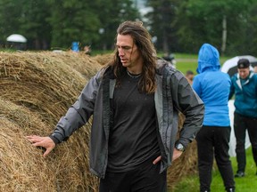 Former NFL athlete Luke Willson examines an obstacle on the set of the reality TV show Canada's Ultimate Challenge.
